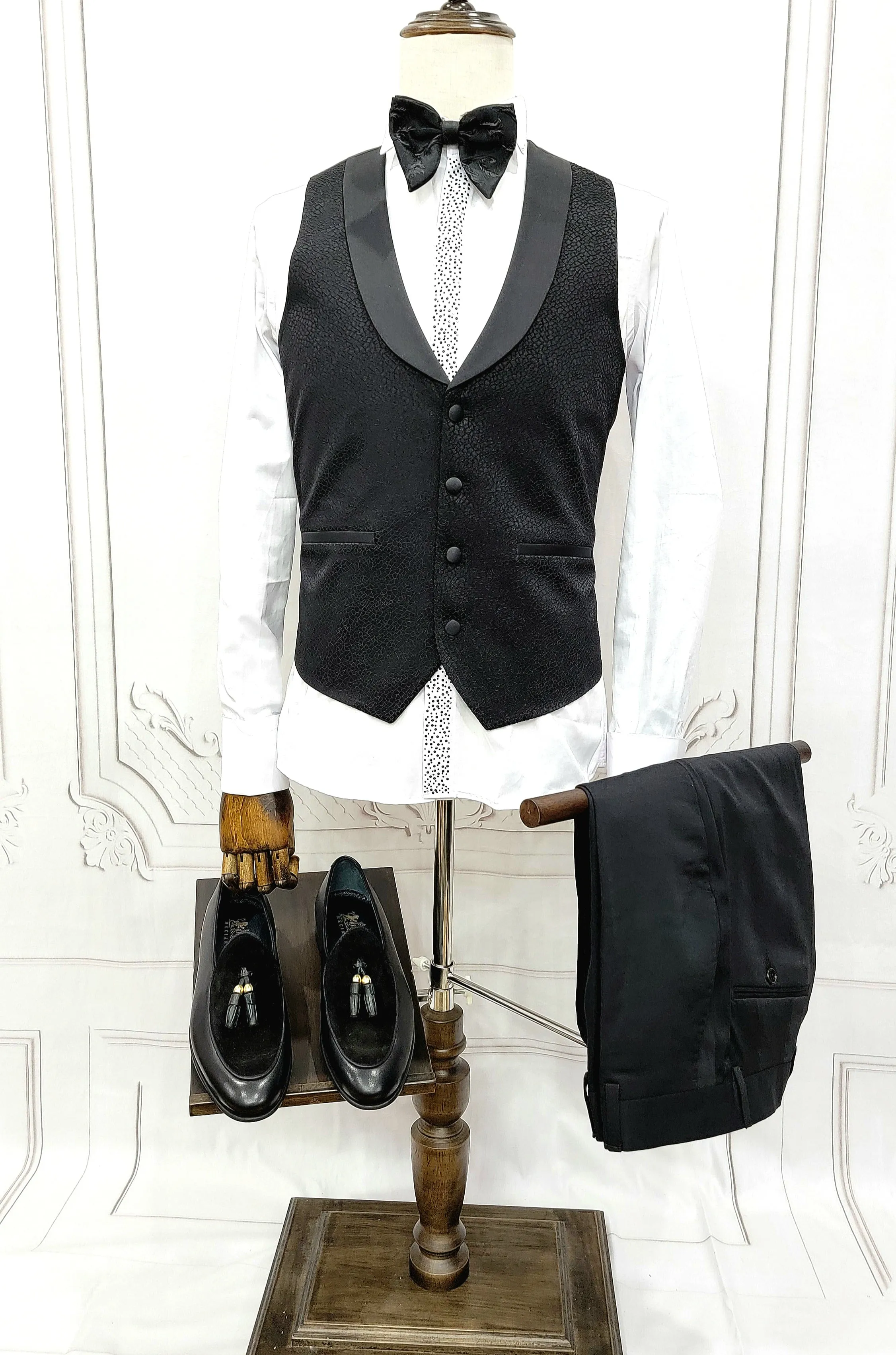 Three Pieces Tuxedo Suit with Contrasting Black velvet Lapel, matching bow tie and Black Pants.